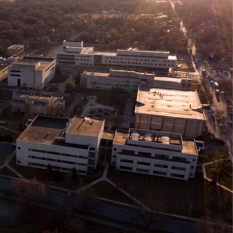 Aerial view of a college campus during sunset.