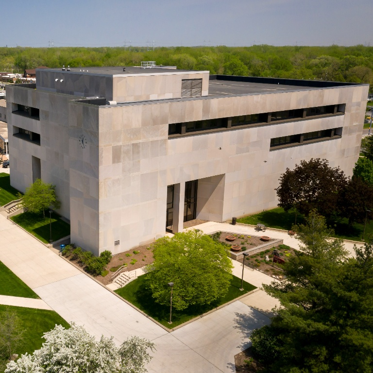 Aerial view of a building on a college campus during the day.