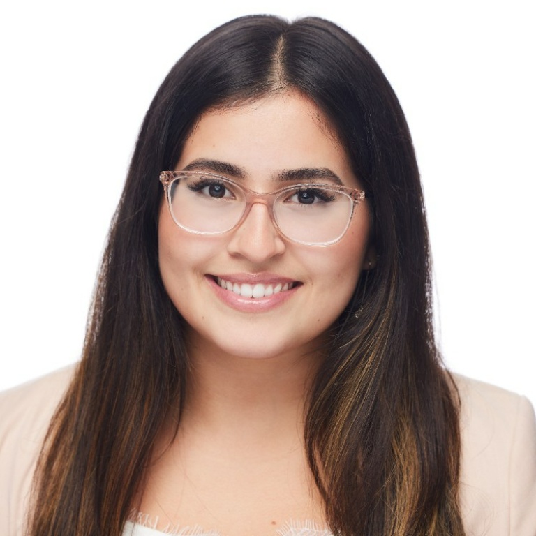 Professional photo of a female student smiling with a white background.
