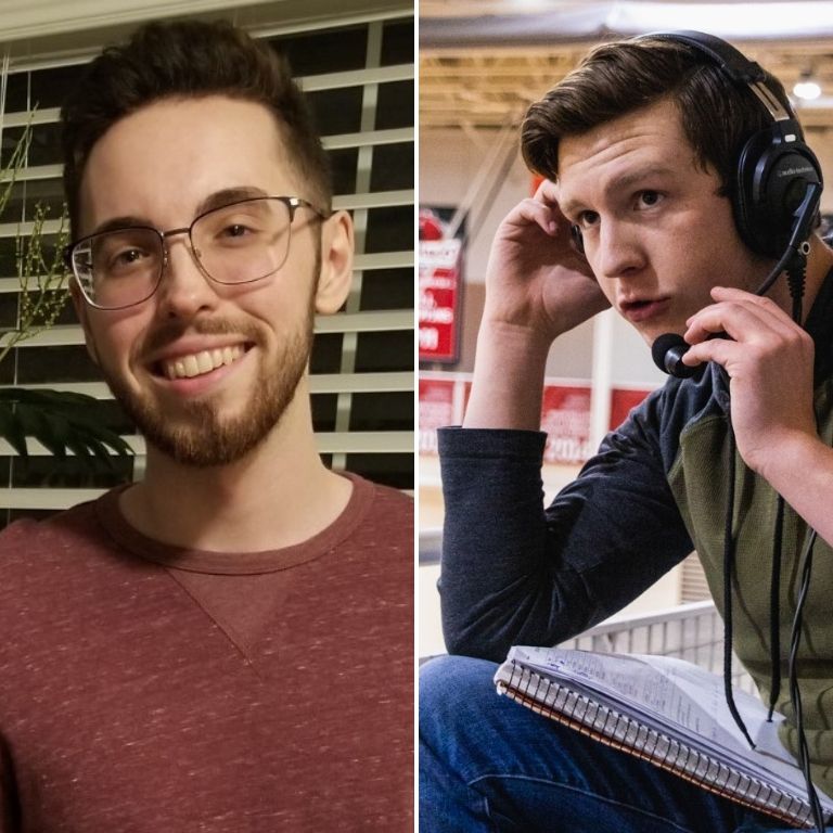 A male student smiling with another male student with a headset on.