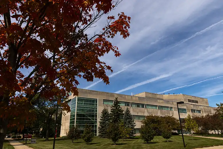 Campus building with trees in foreground